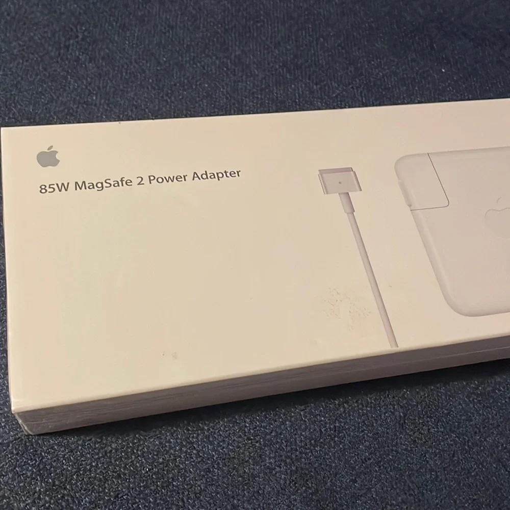 Brand new, unopened Apple 85 W MagSafe 2 Power Adapter.